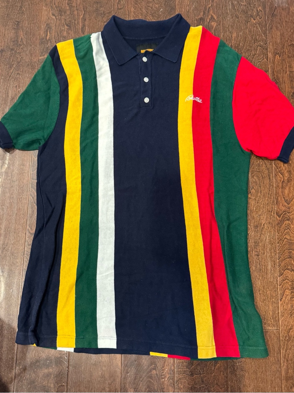 Butter Goods Navy Polo with Green, Yellow, White, and Red Stripes